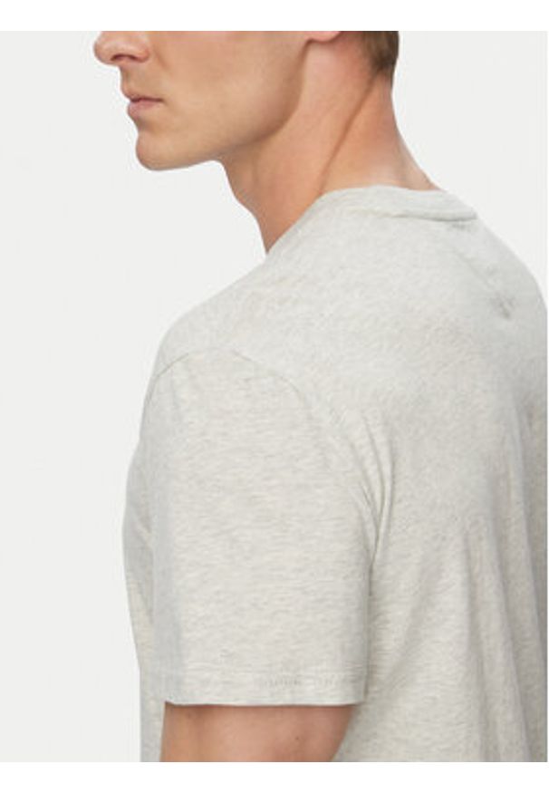 Tommy Jeans T-Shirt Graphic DM0DM23376 Szary jasny Slim Fit. Kolor: szary. Materiał: bawełna