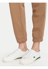 Lacoste Spodnie dresowe XF5268 Beżowy Regular Fit. Kolor: beżowy. Materiał: bawełna #3