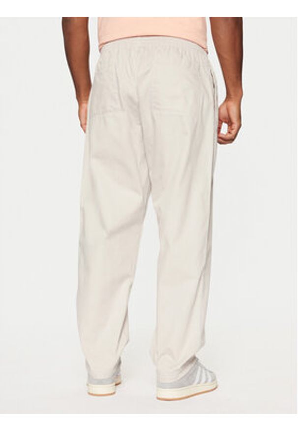 Adidas - adidas Spodnie dresowe Wabash JD0673 Beżowy Loose Fit. Kolor: beżowy. Materiał: bawełna