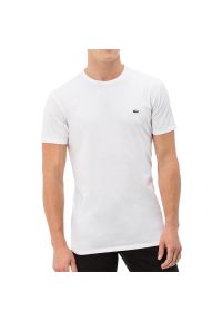 Koszulka Lacoste Overwear T-shirt TH2038-001 - biała. Kolor: biały. Materiał: materiał, bawełna. Długość rękawa: krótki rękaw. Długość: krótkie. Wzór: aplikacja