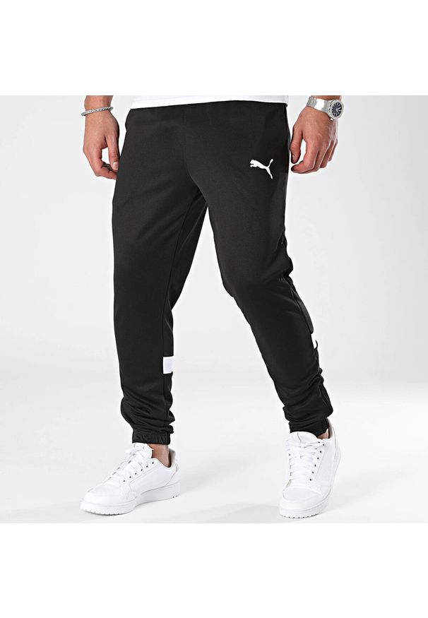 Spodnie dresowe Puma. Kolor: czarny. Materiał: dresówka. Sport: bieganie, piłka nożna