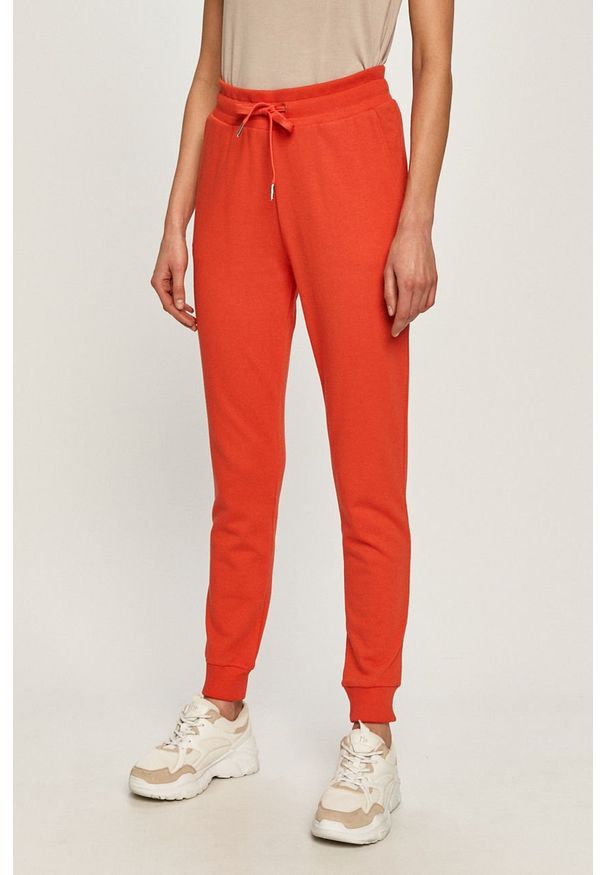 Armani Exchange - Spodnie. Kolor: czerwony. Materiał: bawełna, materiał, dzianina, elastan. Wzór: gładki