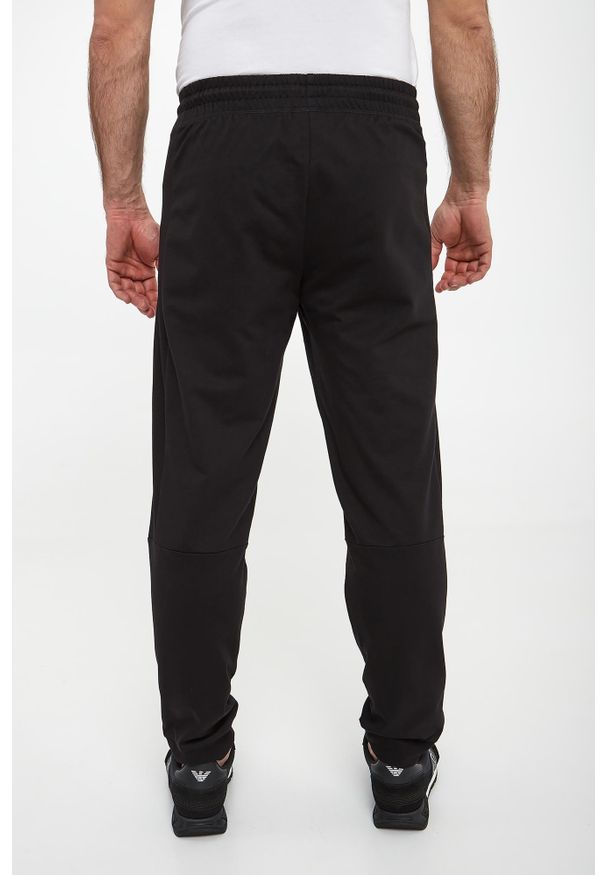 EA7 Emporio Armani - Spodnie dresowe męskie EA7 EMPORIO ARMANI. Materiał: dresówka