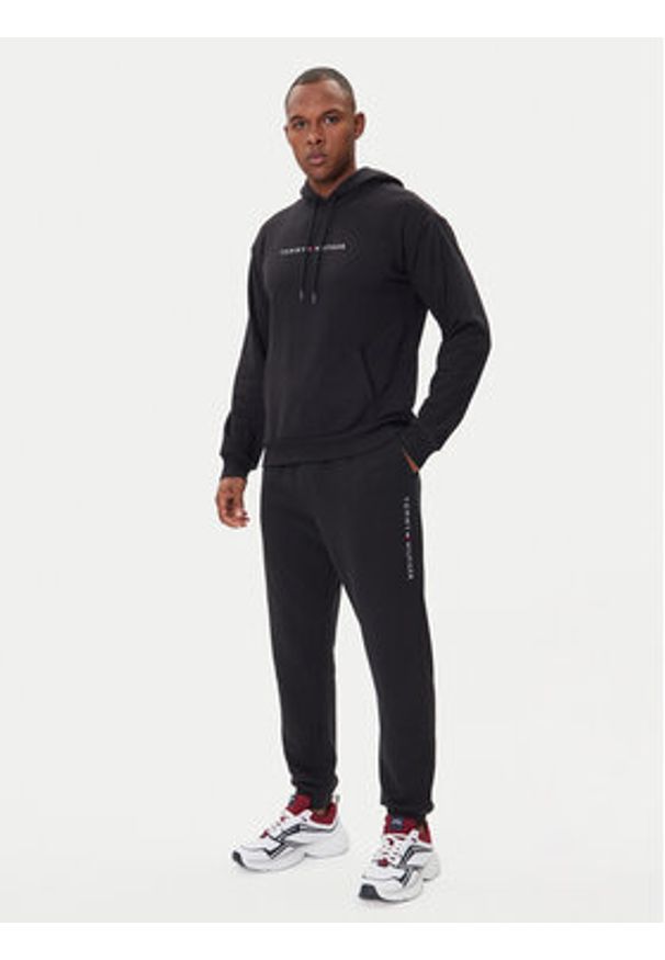 TOMMY HILFIGER - Tommy Hilfiger Spodnie dresowe UM0UM03664 Czarny Regular Fit. Kolor: czarny. Materiał: bawełna