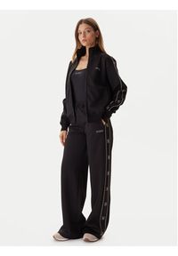 Guess Spodnie dresowe V5BB12 KCX22 Czarny Wide Leg. Kolor: czarny. Materiał: syntetyk #4