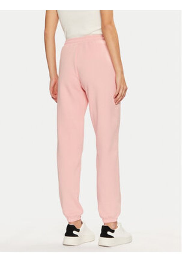 Guess Spodnie dresowe V5RB02 KCLD1 Różowy Regular Fit. Kolor: różowy. Materiał: syntetyk, bawełna