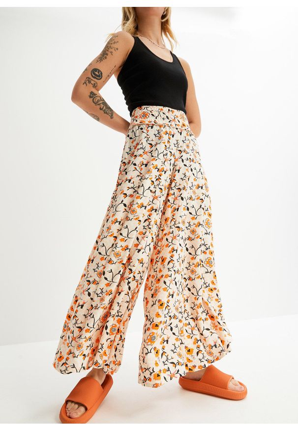 bonprix - Spodnie palazzo z lejącej wiskozy. Kolor: beżowy. Materiał: wiskoza. Wzór: kwiaty