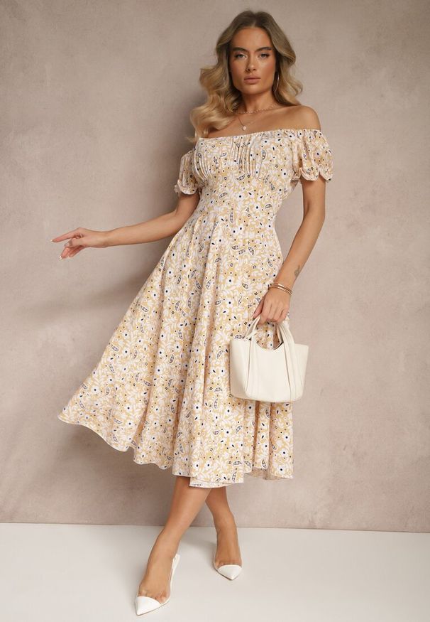 Renee - Żółta Rozkloszowana Sukienka w Kwiatowy Print z Bawełną i Dekoltem Łódką z Bufkami Saniren. Typ kołnierza: dekolt w łódkę. Kolor: żółty. Materiał: bawełna. Wzór: kwiaty, nadruk. Styl: elegancki