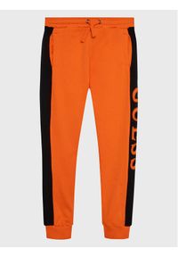 Guess Spodnie dresowe L3RQ24 KA6R3 Pomarańczowy Regular Fit. Kolor: pomarańczowy. Materiał: bawełna