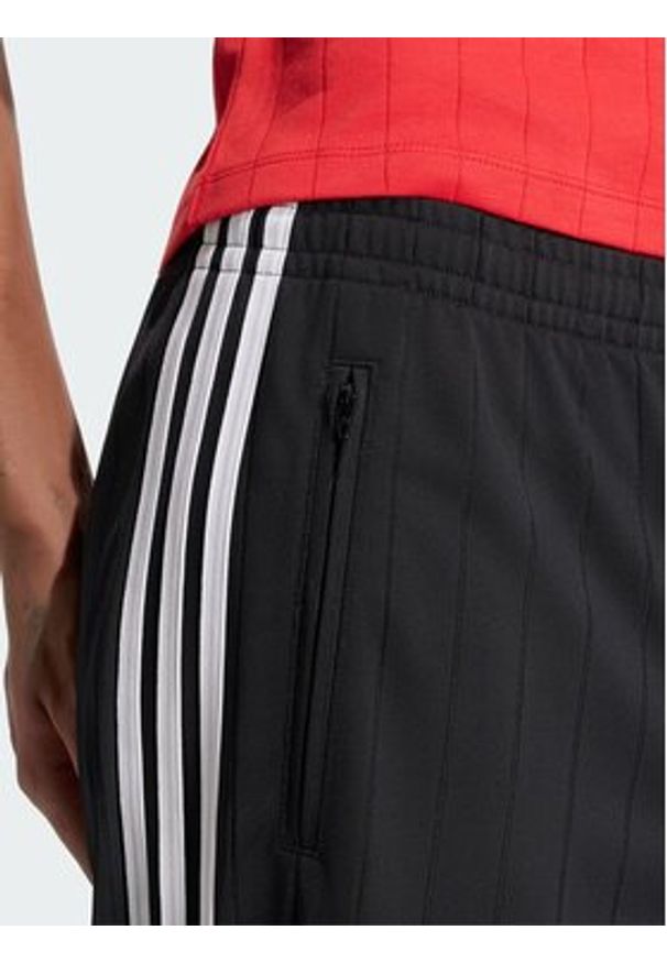 Adidas - adidas Spodnie dresowe Pinstripe Firebird KS6787 Czarny Loose Fit. Kolor: czarny. Materiał: syntetyk