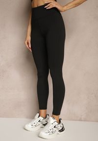 Renee - Czarne Legginsy z Ozdobnymi Przeszyciami z Efektem Modelowania Carittia. Okazja: na co dzień. Kolor: czarny. Długość: długie. Styl: elegancki, casual
