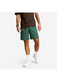 DOMYOS - Spodenki fitness cardio męskie z kieszeniami zapinanymi na zamek. Kolor: zielony. Materiał: poliester, elastan, materiał. Sport: fitness #1