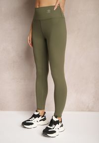 Renee - Ciemnozielone Sportowe Legginsy High Waist z Małym Ozdobnym Znaczkiem Lerilane. Stan: podwyższony. Kolor: zielony. Styl: sportowy