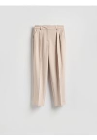 Reserved - Spodnie z kantem - beżowy. Kolor: beżowy. Materiał: tkanina, wiskoza #1