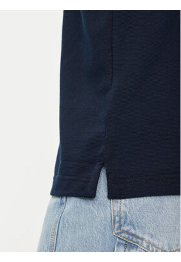 Tommy Jeans Polo Skipper DM0DM21657 Granatowy Regular Fit. Typ kołnierza: polo. Kolor: niebieski. Materiał: bawełna, syntetyk