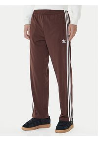 Adidas - adidas Spodnie dresowe adicolor Classics Firebird KA0482 Brązowy Regular Fit. Kolor: brązowy. Materiał: syntetyk #1