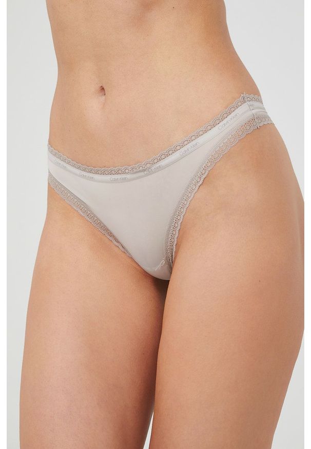 Calvin Klein Underwear stringi (3-pack) kolor beżowy. Kolor: beżowy. Materiał: materiał. Wzór: gładki
