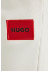 Hugo - HUGO spodnie damskie kolor beżowy gładkie. Kolor: beżowy. Materiał: dzianina. Wzór: gładki #3