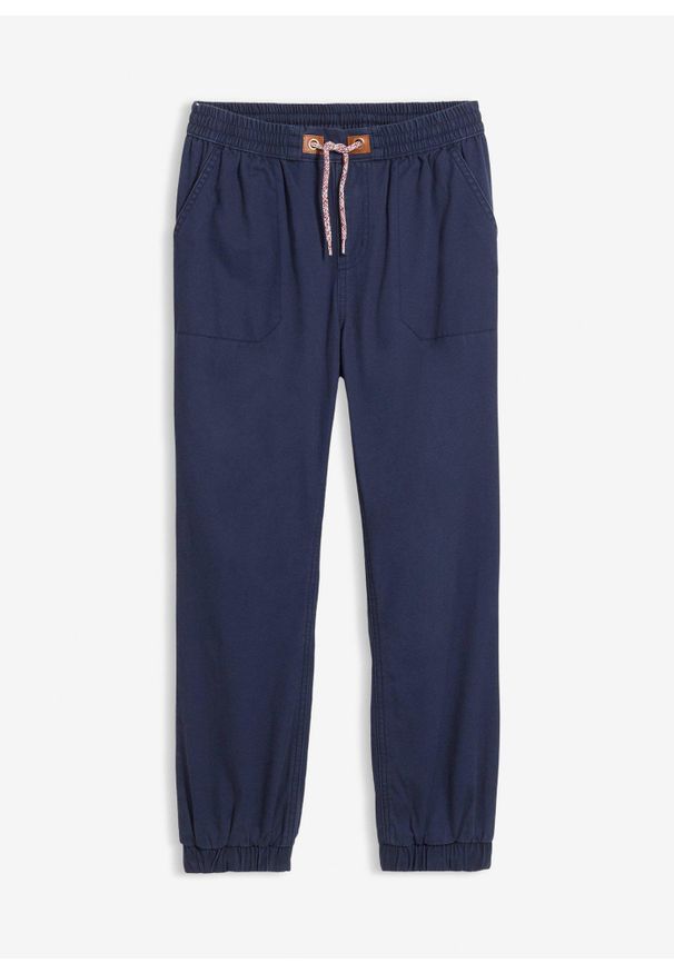 bonprix - Spodnie chłopięce ocieplane z podszewką z dżerseju, regular fit. Kolor: niebieski. Materiał: bawełna, jersey. Styl: sportowy