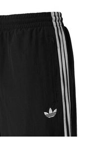 Adidas - adidas Spodnie dresowe Firebird Woven KE1371 Czarny Regular Fit. Kolor: czarny. Materiał: syntetyk #3