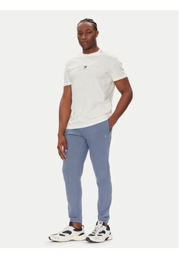 Tommy Jeans Spodnie dresowe Flag DM0DM20473 Niebieski Slim Fit. Kolor: niebieski. Materiał: bawełna
