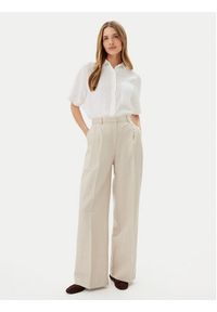 TOMMY HILFIGER - Tommy Hilfiger Spodnie materiałowe WW0WW45460 Beżowy Relaxed Fit. Kolor: beżowy. Materiał: syntetyk
