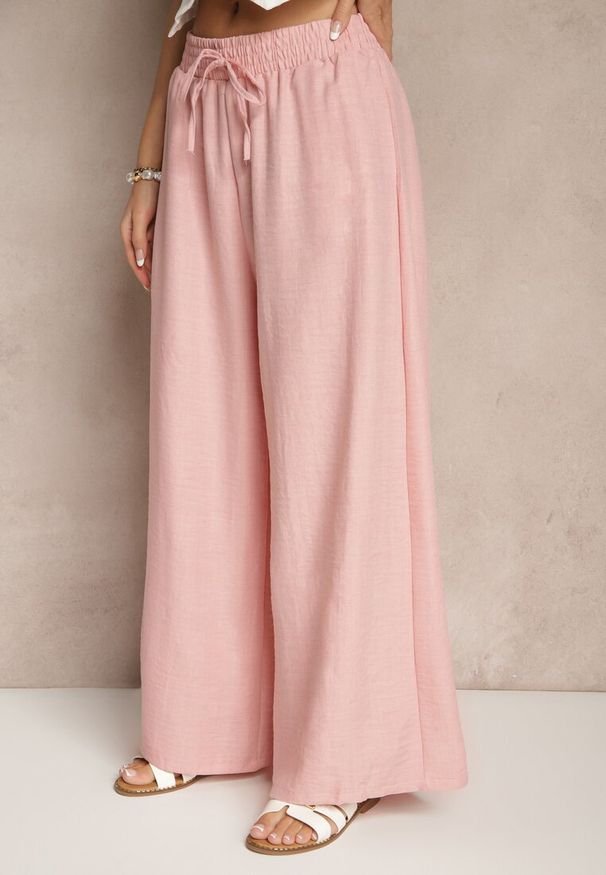 Renee - Różowe Szerokie Spodnie High Waist Ozdobione Wiązaniem Telonia. Okazja: na co dzień. Stan: podwyższony. Kolor: różowy. Wzór: aplikacja. Styl: elegancki, casual