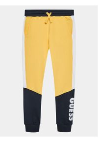 Guess Spodnie dresowe L3BQ11 KAX73 Żółty Regular Fit. Kolor: żółty. Materiał: bawełna