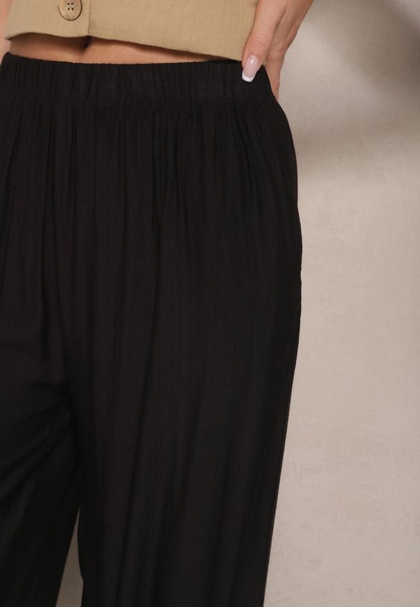 Renee - Czarne Spodnie Palazzo o Szerokim Kroju High Waist Lislevia. Okazja: na co dzień. Stan: podwyższony. Kolor: czarny. Styl: casual, elegancki