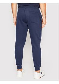 Tommy Jeans Spodnie dresowe DM0DM15380 Granatowy Slim Fit. Kolor: niebieski. Materiał: syntetyk