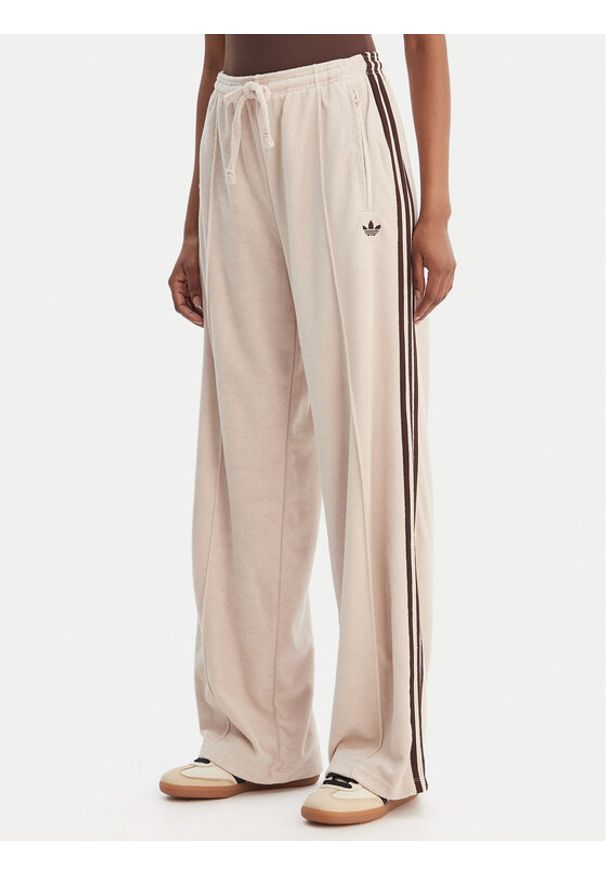 Adidas - adidas Spodnie dresowe Terry Towel Firebird KQ6661 Beżowy Loose Fit. Kolor: beżowy. Materiał: bawełna