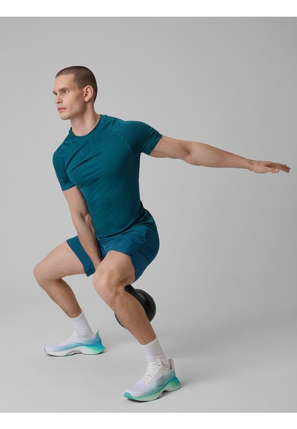 4f - 4F Koszulka treningowa slim bezszwowa męska - granatowa L/XL. Kolor: niebieski. Materiał: skóra. Długość rękawa: raglanowy rękaw. Długość: długie. Sport: fitness