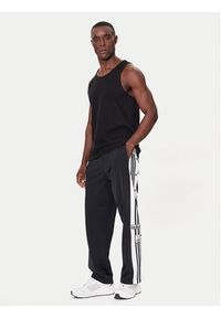 Adidas - adidas Spodnie dresowe Adibreak JP3760 Czarny Regular Fit. Kolor: czarny. Materiał: syntetyk