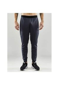 Spodnie treningowe męskie Craft Evolve Slim. Kolor: szary. Materiał: dresówka. Sport: fitness