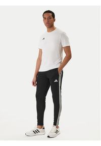 Adidas - adidas Spodnie dresowe Tiro 25 Essentials Training JD0442 Czarny Regular Fit. Kolor: czarny. Materiał: syntetyk #3