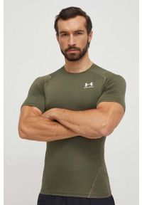 Under Armour t-shirt treningowy kolor zielony gładki. Kolor: zielony. Materiał: skóra, materiał. Długość rękawa: raglanowy rękaw. Wzór: gładki