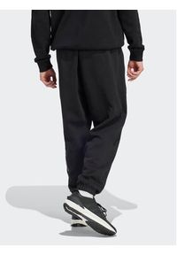 Adidas - adidas Spodnie dresowe HY1288 Czarny Loose Fit. Kolor: czarny. Materiał: dresówka, bawełna #8