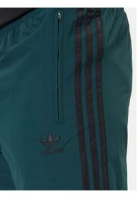 Adidas - adidas Spodnie dresowe adicolor Woven Firebird JY1335 Zielony Regular Fit. Kolor: zielony. Materiał: syntetyk #4
