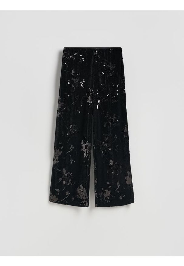 Reserved - Spodnie z cekinami - czarny. Kolor: czarny. Materiał: dzianina