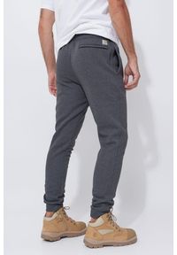 Spodnie męskie dresowe Carhartt Midweight Graphic Jogger. Kolor: szary. Materiał: dresówka