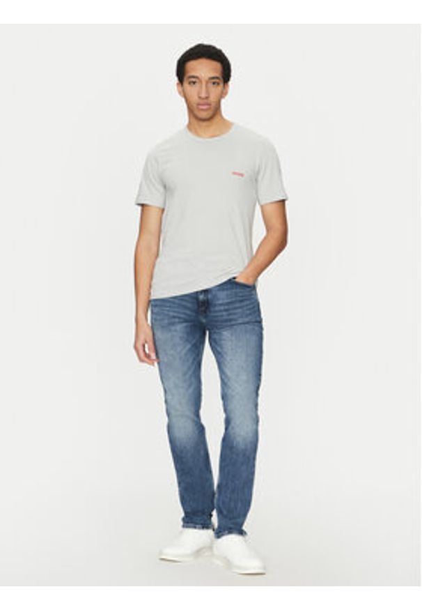 Hugo - HUGO Jeansy 50530587 Niebieski Slim Fit. Kolor: niebieski