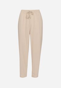 Born2be - Beżowe Spodnie Luźne z Kieszeniami i Gumką w Talii oraz Sznurkiem Enivia. Okazja: na co dzień. Kolor: beżowy. Styl: elegancki, casual
