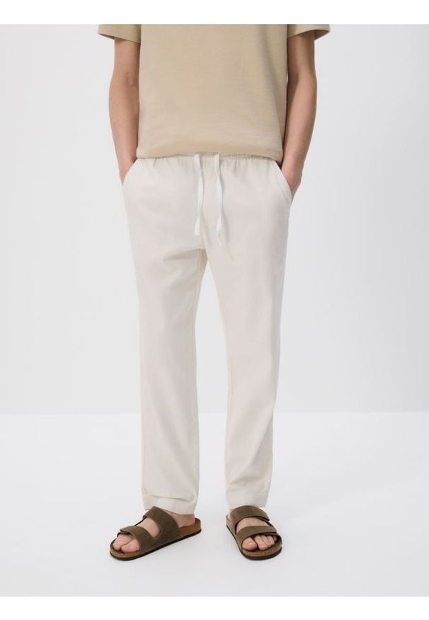Reserved - Bawełniane spodnie jogger - złamana biel. Materiał: bawełna