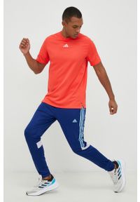 Adidas - adidas spodnie treningowe Tiro męskie kolor niebieski z aplikacją. Kolor: niebieski. Materiał: materiał, dzianina, skóra. Wzór: aplikacja. Sport: fitness #3