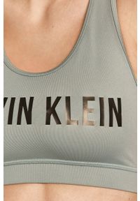 Calvin Klein Performance - Biustonosz sportowy. Kolor: zielony. Rodzaj stanika: odpinane ramiączka. Wzór: nadruk #2