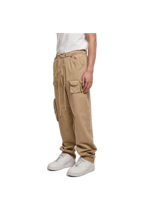 Spodnie Urban Classics Asymetric. Kolor: beżowy. Materiał: materiał