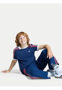 Adidas - adidas Spodnie dresowe Firebird Double Knit KD7825 Granatowy Loose Fit. Kolor: niebieski. Materiał: syntetyk #3