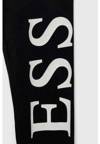 Guess legginsy dziecięce kolor czarny z nadrukiem. Kolor: czarny. Wzór: nadruk #2