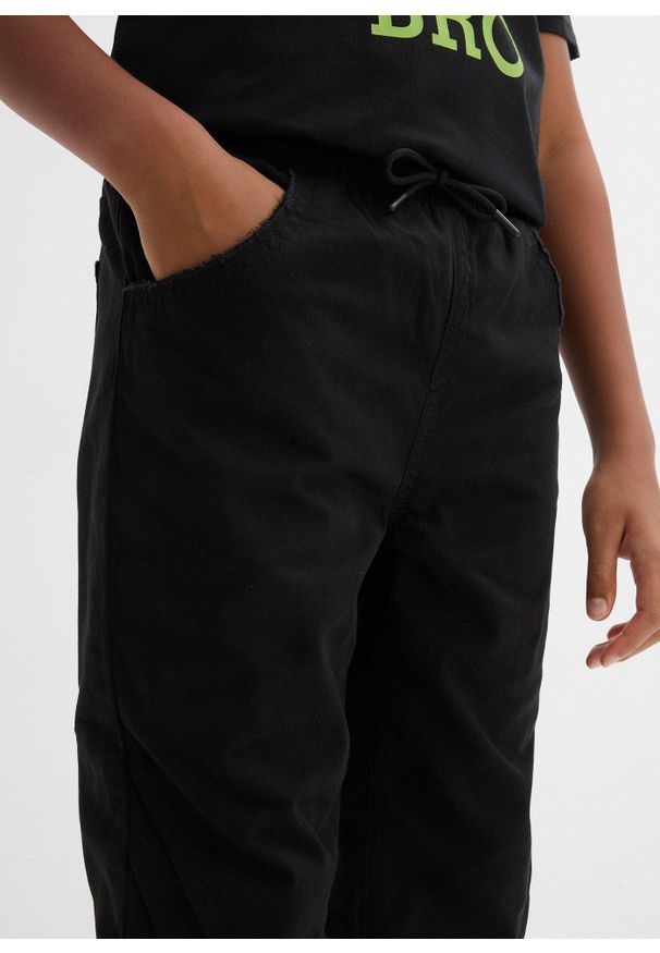 bonprix - Spodnie ocieplane chłopięce z gumką w talii, regular fit. Kolor: czarny