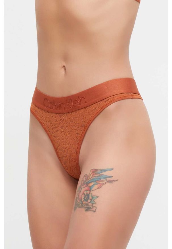 Calvin Klein Underwear stringi kolor pomarańczowy z koronki. Kolor: pomarańczowy. Materiał: koronka. Wzór: koronka